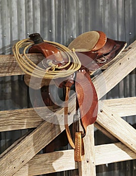 A Saddle and a Lariat on a Gate photo
