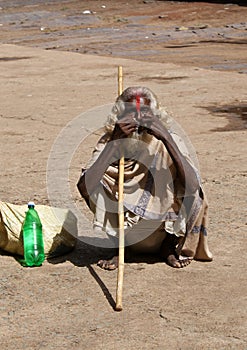 sadhu/holy man in India squatting