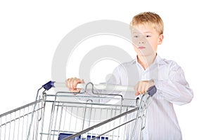Sadness boy is standing near shopping basket