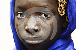 Sadness and Despair Symbol - Cute African School Girl With a Blue Scarf on Her head