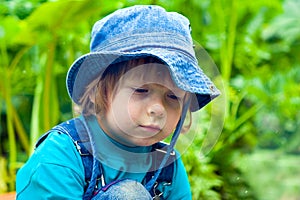 Sadness dirty beauty boy in grass