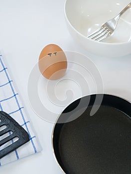 Sadness emotion of egg with pan on white background