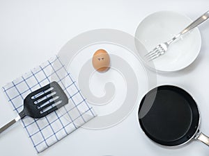Sadness emotion of egg with pan on white background
