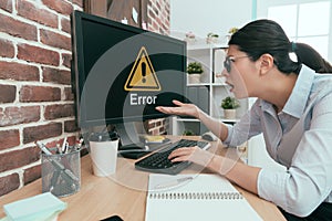 Sadness suit woman sitting on working desk