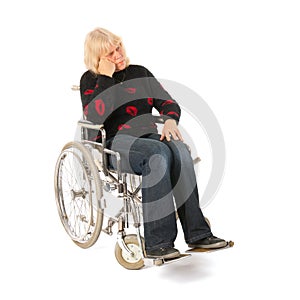 Sadness woman of mature age in wheel chair