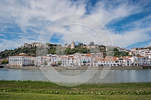 Sado river, city architecture and castle on the hill, AlcÃ¡cer do Sal - PORTUGAL photo