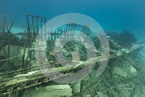 Safari boat wreckage and aquatic life in the Red Sea.