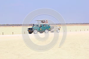 Safari jeep group tourists Etosha Pan, Namibia