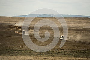 Safari jeeps crossing Serengeti, Tanzania