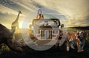 Safari:woman in the jeep discovering wild nature
