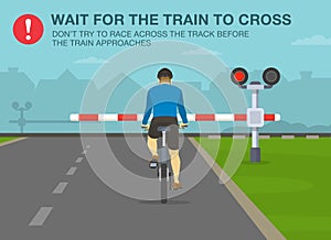 Safe bicycle riding rules and tips. Wait for the train to cross, don`t try to race across the track before the train approaches.