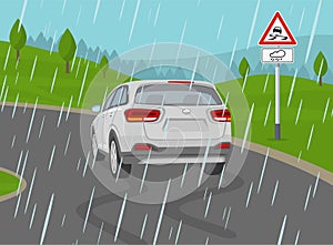 Safe car driving rules and tips. Driving on a rainy and slippery road. Skidded white suv car on the wet road.