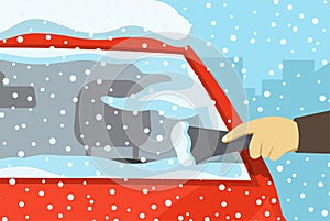 Safe car driving rules and tips. Winter season driving. Close-up of a hand cleaning a vehicle`s windshield from ice and snow.