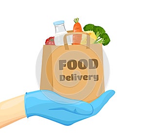 Safe food delivery. Hand in blue rubber glove holds craft paper bag with food. Quarantine.