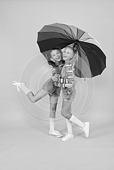 Safe place. Schoolgirls happy umbrella. Fall weather forecast. Safety concept. Fashion accessory. Girls friends with