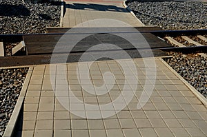 Safe railway crossing, pedestrian, cyclist and vehicle crossing. rubber black grate, mattress between train tracks, tram. paving i