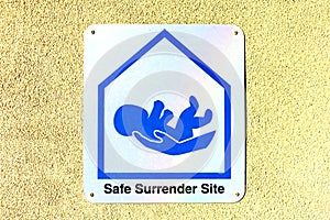 Safe surrender baby site sign. Safe surrender sites are hospitals or fire stations. Safe surrender means giving up a baby in a