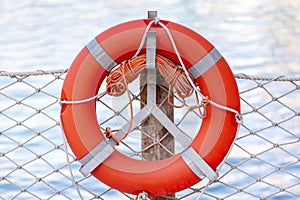 Safeguard ring at the beach. Device helping to float on water. Rescue assistance.