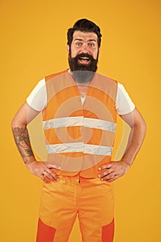 Safety apparel for construction industry. Bearded brutal hipster safety engineer. High visibility reflective safety vest