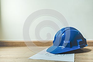 Safety blue helmet and home construction plan, architecture or construction or industrial equipments, with copy space