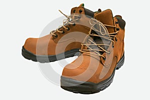 Safety boots isolated on white background, close up new boots on white background, Worker used boots shoe in heavy industry