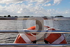 Safety buoy life ring on a railing of a boat