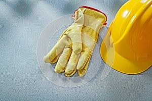 Safety cap protective gloves on concrete surface construction co