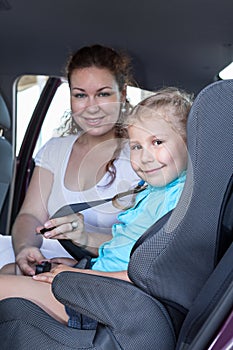 Safety children transportation with car seat in vehicle
