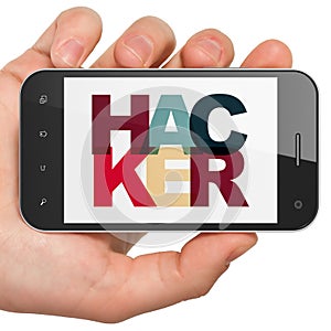 Safety concept: Hand Holding Smartphone with Hacker on display