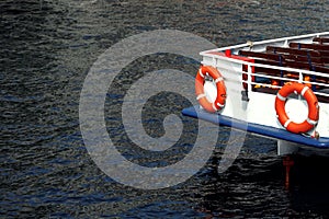 Safety concept: Red life buoy on the boat ready for use