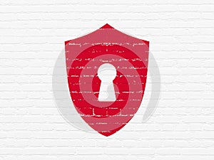 Safety concept: Shield With Keyhole on wall background