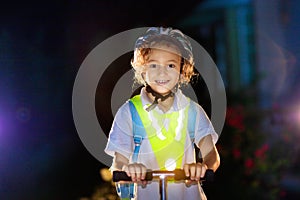 Safety on dark street. Kids reflective vest