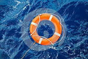 Safety equipment, Life buoy or rescue buoy floating on sea to rescue people from drowning man photo