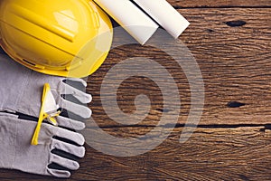 Safety equipment and tool kit on wooden background