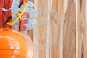 Safety equipment and tool kit on wooden table