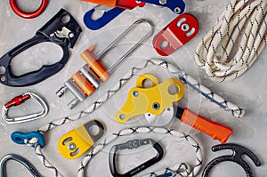 Safety equipment using in alpinism over concrete background photo