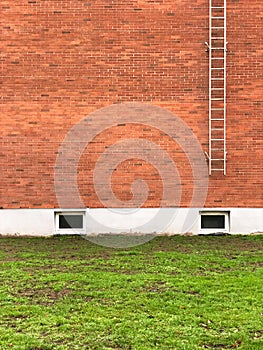 Safety exit ladders on brick wall building