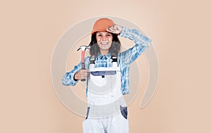 Safety expert. Architecture. woman architect in helmet. girl in checkered shirt and protective hard hat. building and