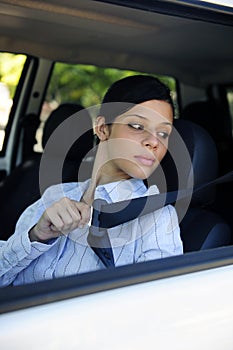 Safety: female driver fastening seat belt