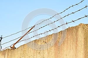 Safety fence of barbed wire photo