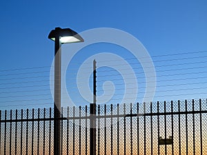 Safety fence lighted by dusk photo