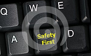 Safety first concept with yellow key on computer keyboard