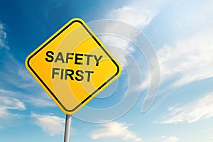 Safety first road sign with blue sky and cloud background