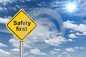 Safety first sign banner and clouds blue sky