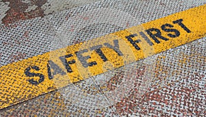 Safety First Sign on caution strip.