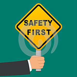 Safety first sign in hand concept