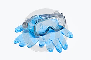Safety glasses and protective glove isolated