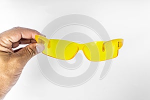 Safety glasses with yellow lenses, also used for observing corals under blue light in marine aquariums