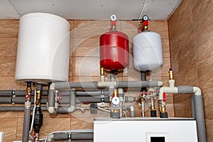 Safety group for underfloor heating and hot water in the installation of a modern heat pump in a boiler room.