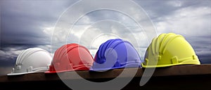 Safety hard hats on grey sky background, 3d illustration